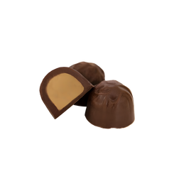 Haven Herb milk chocolate domes with creamy peanut butter filling close up on black background